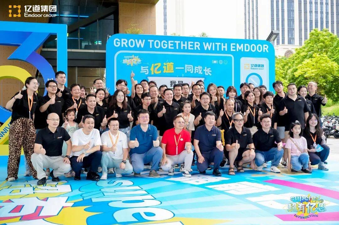 A photographer captures candid moments of Emdoor employees enjoying the festive atmosphere. A photographer captures candid moments of Emdoor employees enjoying the festive atmosphere.