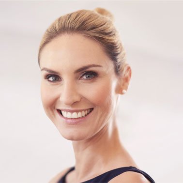 A woman with a bright smile and clear skin, showcasing confidence and professionalism, suitable for corporate or technology-related themes.