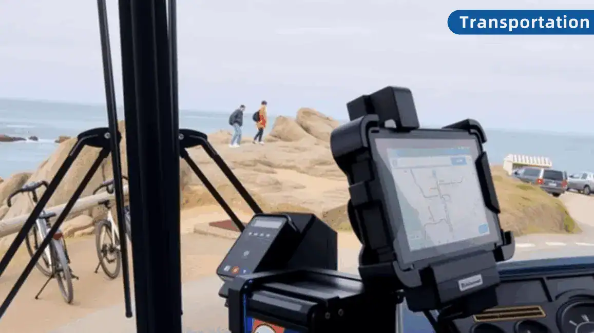 Bus-mounted tablet and ticket printer beside the windscreen